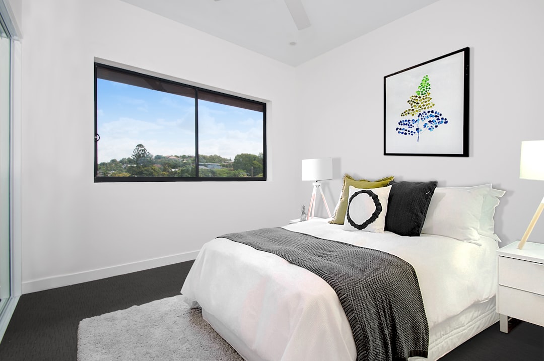 Bright private bedroom with a double bed and large window