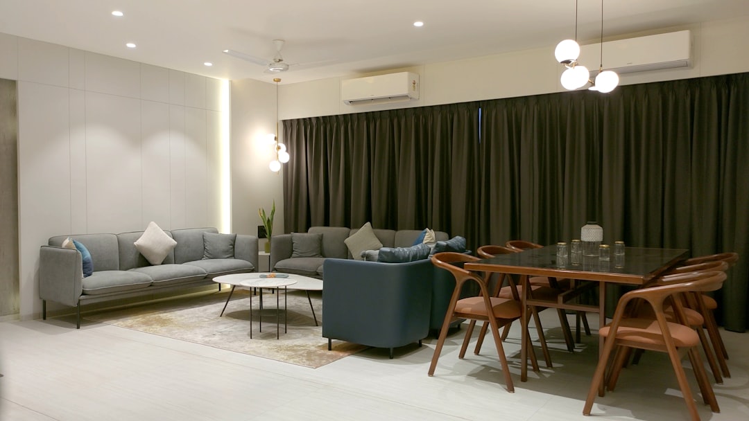 Shared apartment living and dining area with sofas and a dining table